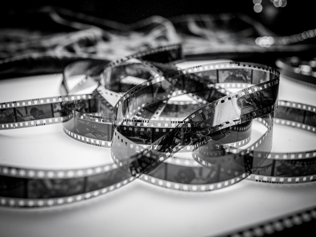 Tangled 35mm film strips on a light table